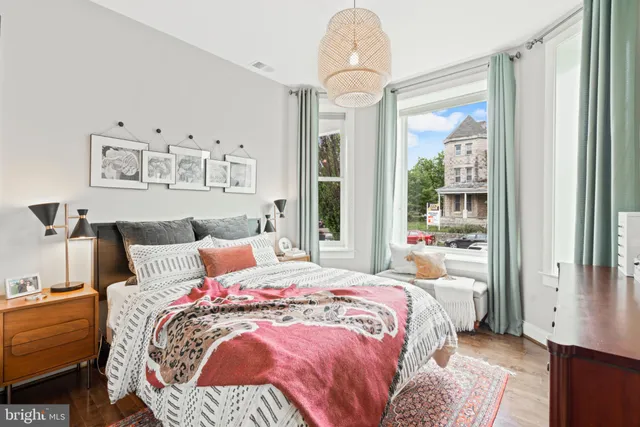 a bedroom with bed and a window