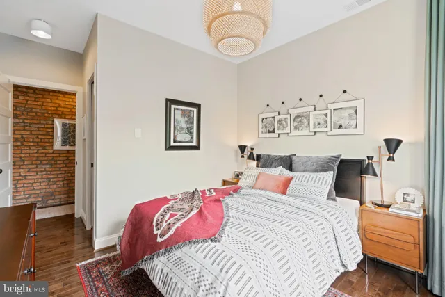 a bedroom with bed and a window