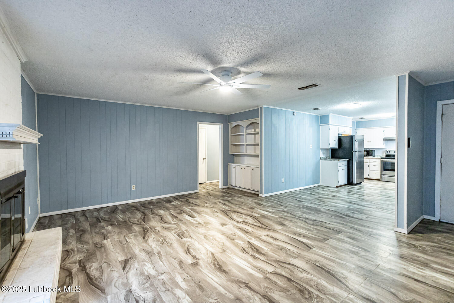 4305 52nd Street, Unit A Lubbock, TX 79413 - Photo 13 of 38 a view of a livingroom with a flat screen tv