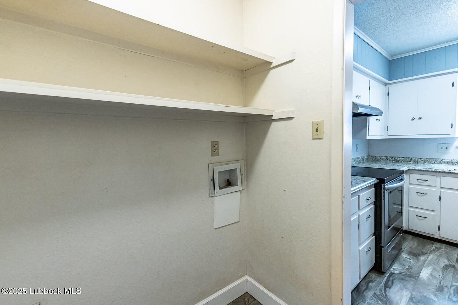 4305 52nd Street, Unit A Lubbock, TX 79413 - Photo 23 of 38 a kitchen with a refrigerator and a stove