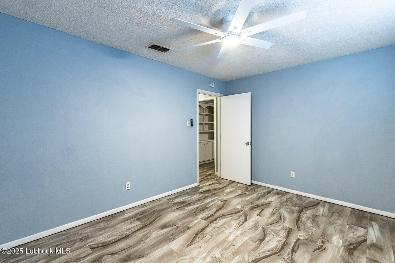 4305 52nd Street, Unit A Lubbock, TX 79413 - Photo 24 of 38 a view of a room with a fan