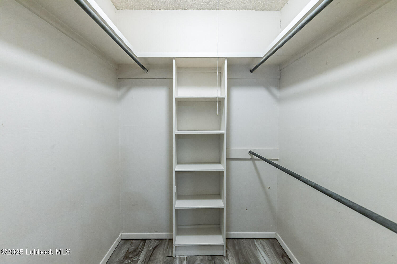 4305 52nd Street, Unit A Lubbock, TX 79413 - Photo 26 of 38 a view of an empty walk in closet
