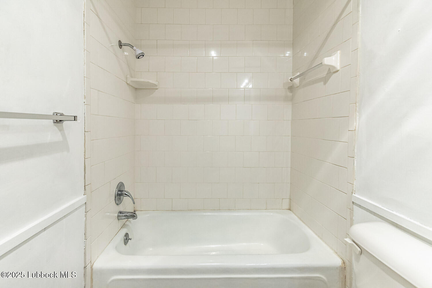 4305 52nd Street, Unit A Lubbock, TX 79413 - Photo 28 of 38 a bathroom with a bathtub