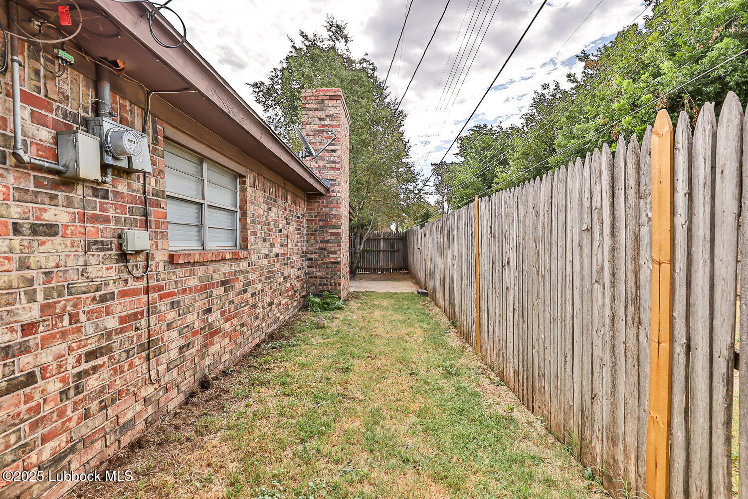4305 52nd Street, Unit A Lubbock, TX 79413 - Photo 6 of 38 a view of a pathway with a building in the background