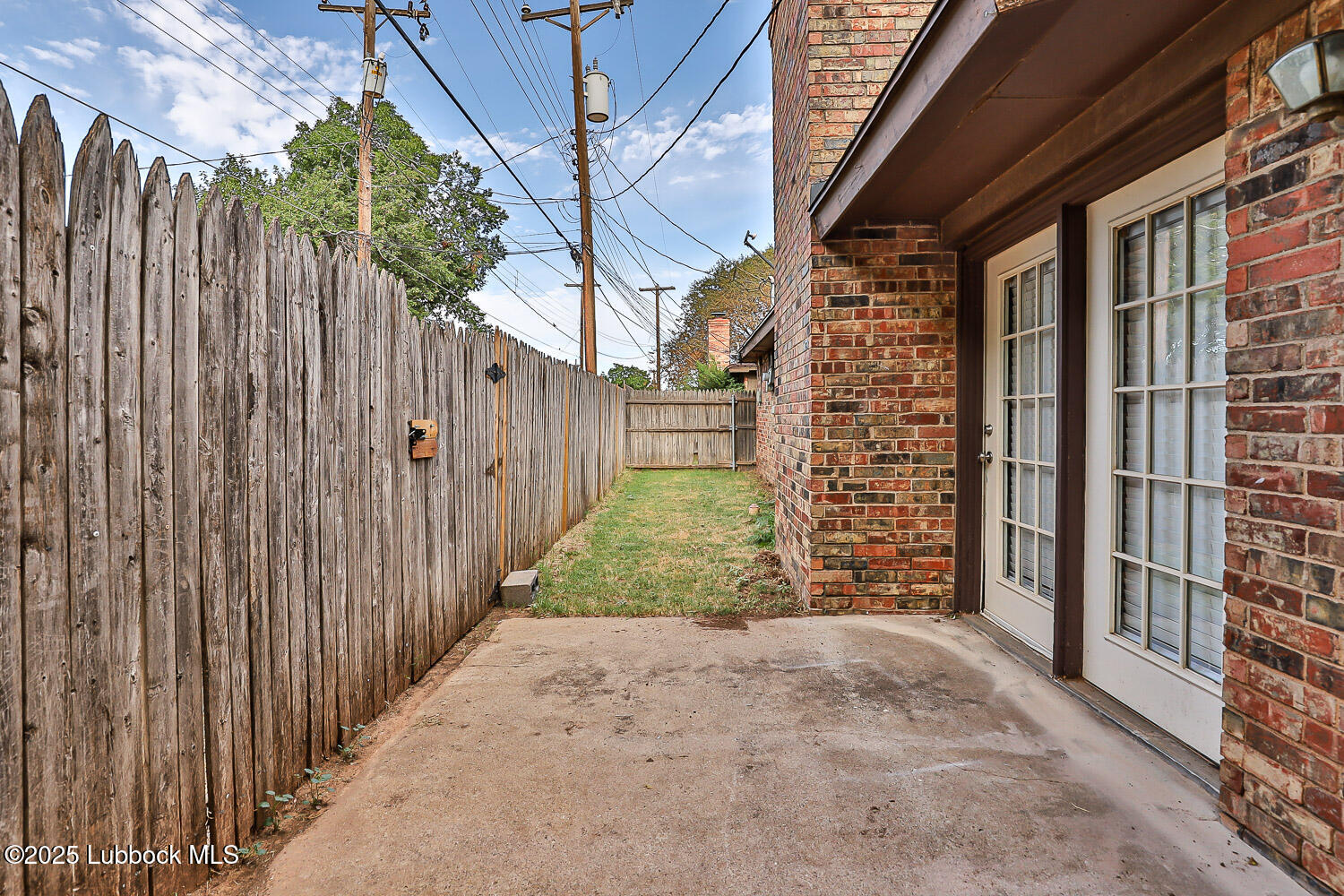 4305 52nd Street, Unit A Lubbock, TX 79413 - Photo 8 of 38 a view of a backyard with wooden fence