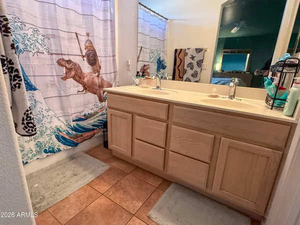 a bathroom with a sink a mirror and vanity