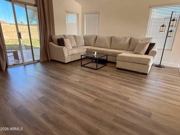 a living room with furniture and a large window