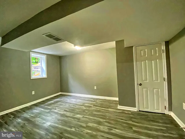a view of room with window and entryway