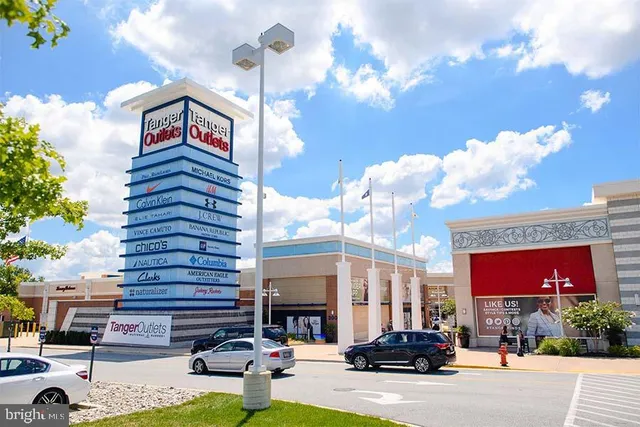 a view of a balcony with furniture and city view