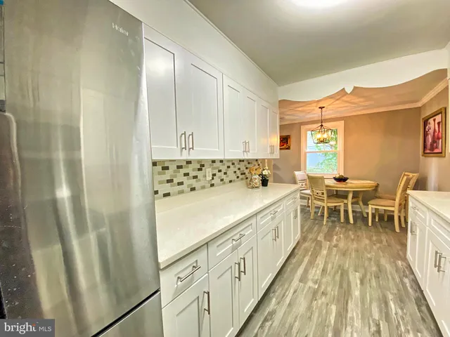 a spacious bathroom with a sink a mirror and a bathtub