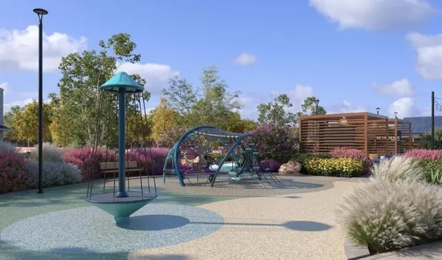 a childrens park with lots of swings and slides