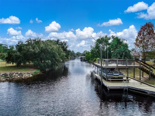 a view of a lake with a house in the background