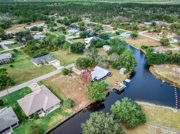 an aerial view of a houses with outdoor space and street view