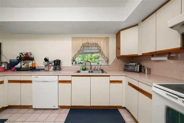a kitchen with stainless steel appliances a refrigerator and a stove top oven