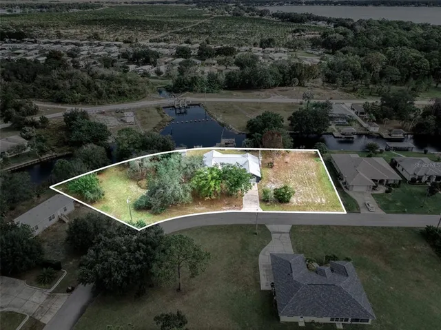 a view of a lake with a house in the background