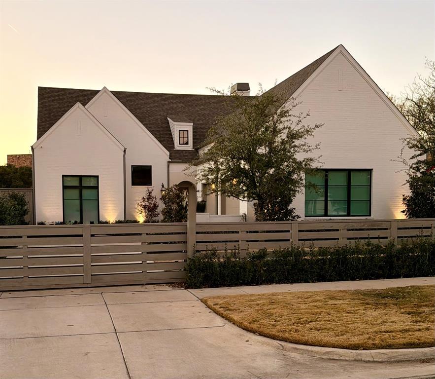 7519 Taos Road Dallas, TX 75209 - Photo 11 of 40 View of front facade with a fenced front yard, a chimney, and roof with shingles