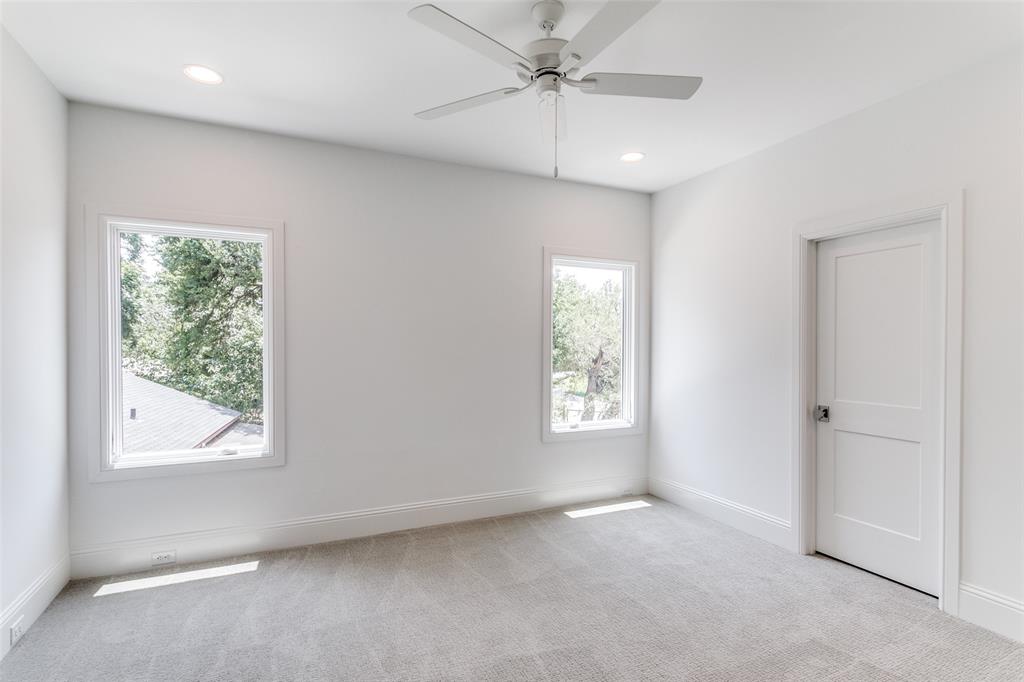 7519 Taos Road Dallas, TX 75209 - Photo 12 of 40 Empty room with light colored carpet, ceiling fan, and recessed lighting