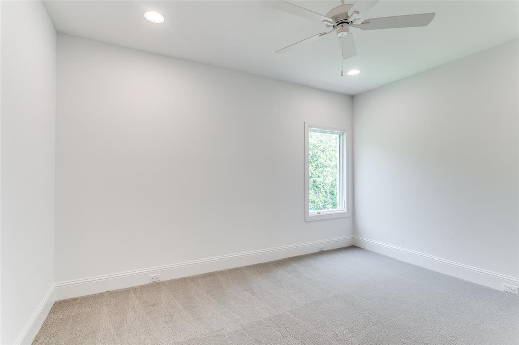 7519 Taos Road Dallas, TX 75209 - Photo 13 of 40 Empty room with light carpet, recessed lighting, and a ceiling fan
