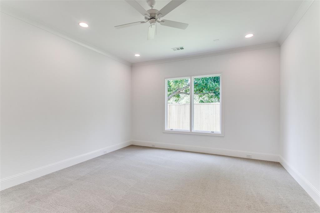 7519 Taos Road Dallas, TX 75209 - Photo 17 of 40 Empty room with crown molding, light carpet, ceiling fan, and recessed lighting