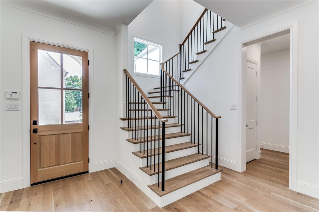 7519 Taos Road Dallas, TX 75209 - Photo 21 of 40 Foyer entrance with light wood-style flooring and stairway