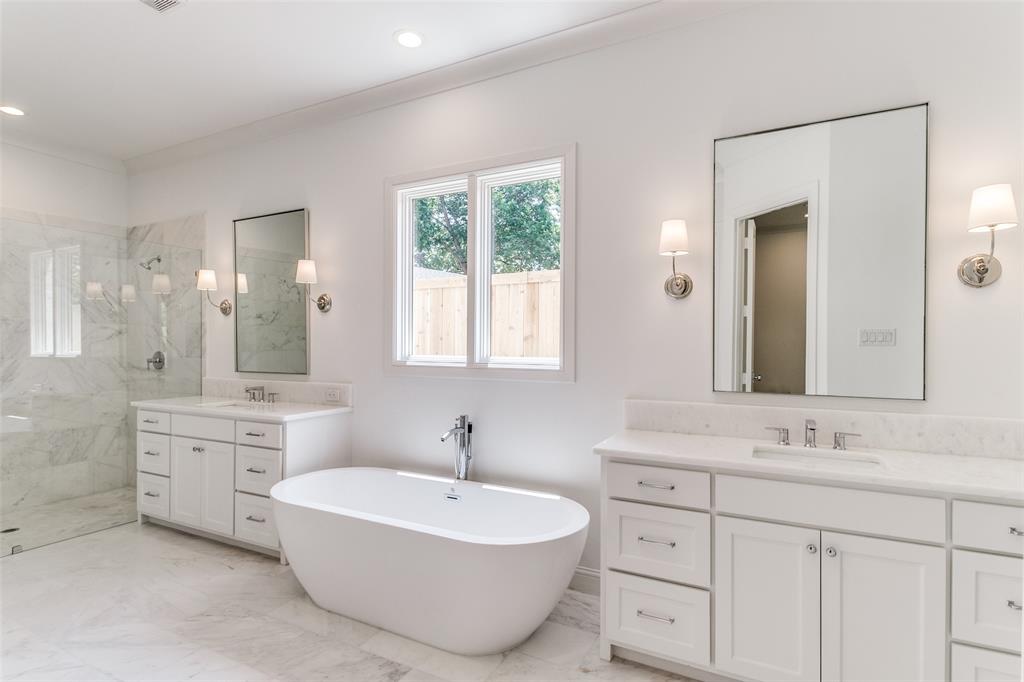 7519 Taos Road Dallas, TX 75209 - Photo 31 of 40 Bathroom featuring a marble finish shower, two vanities, a freestanding tub, light marble finish floors, and ornamental molding