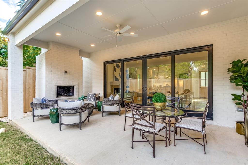 7519 Taos Road Dallas, TX 75209 - Photo 33 of 40 View of patio featuring an outdoor living space with a fireplace and a ceiling fan