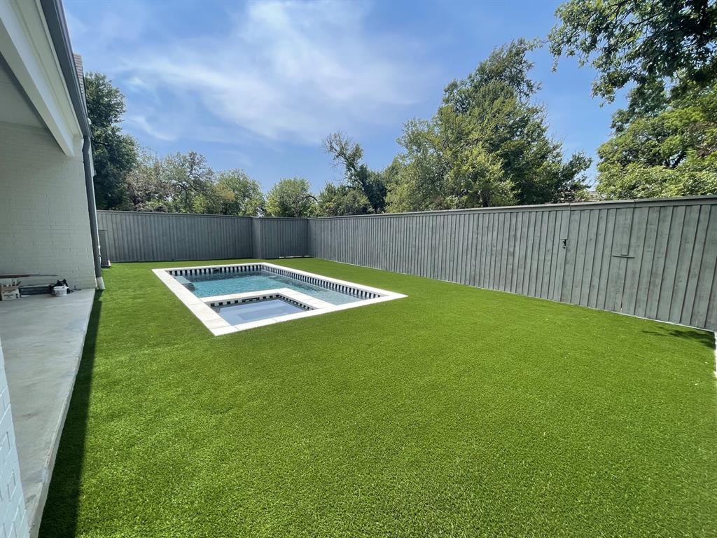 7519 Taos Road Dallas, TX 75209 - Photo 37 of 40 Fenced backyard featuring a patio and an in-ground hot tub