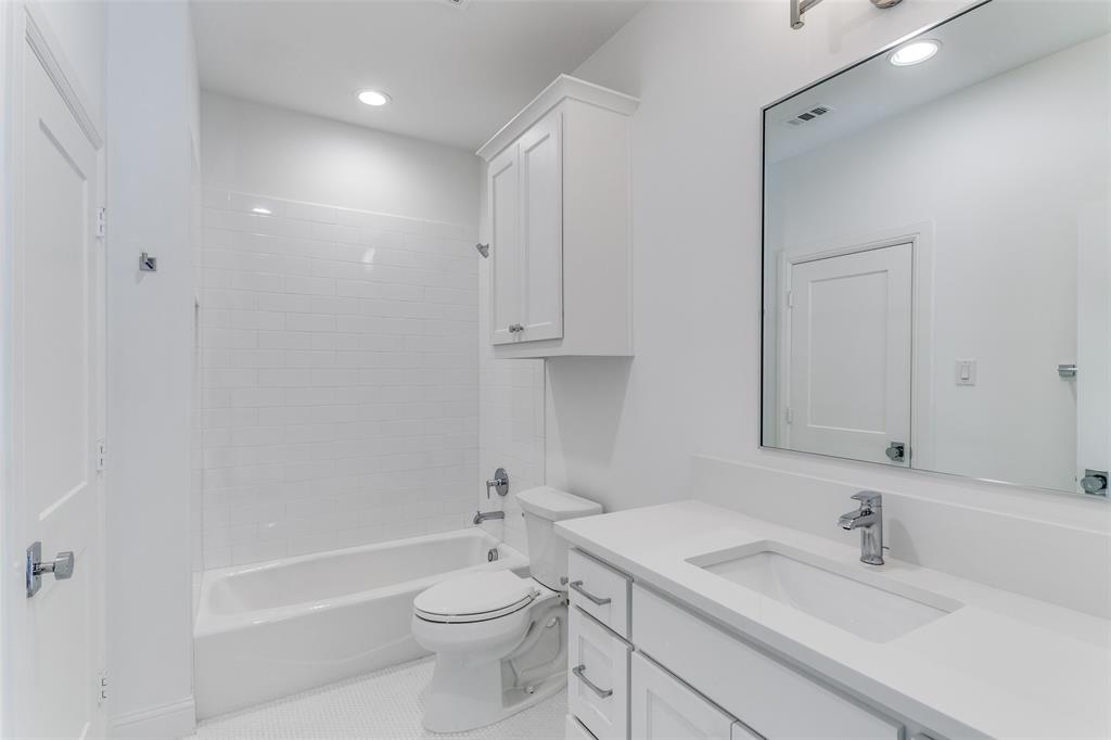 7519 Taos Road Dallas, TX 75209 - Photo 9 of 40 Full bath featuring vanity, washtub / shower combination, tile patterned flooring, and recessed lighting