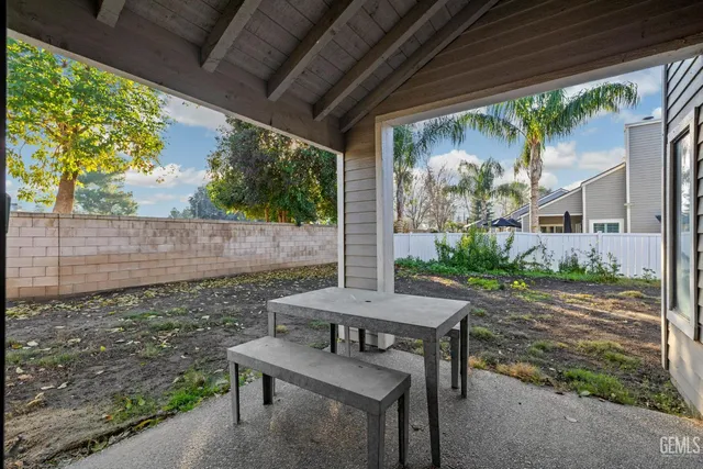 a view of yard with patio