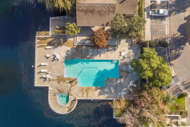 an aerial view of a house with a yard
