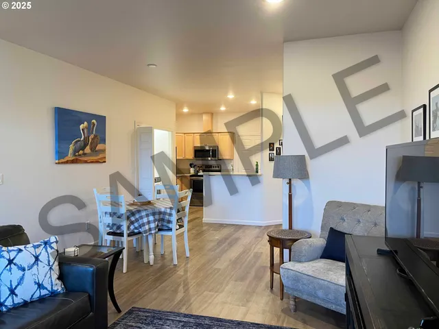 a kitchen with stainless steel appliances granite countertop a refrigerator stove and microwave