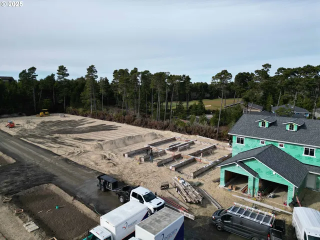 an aerial view of a yard with horses