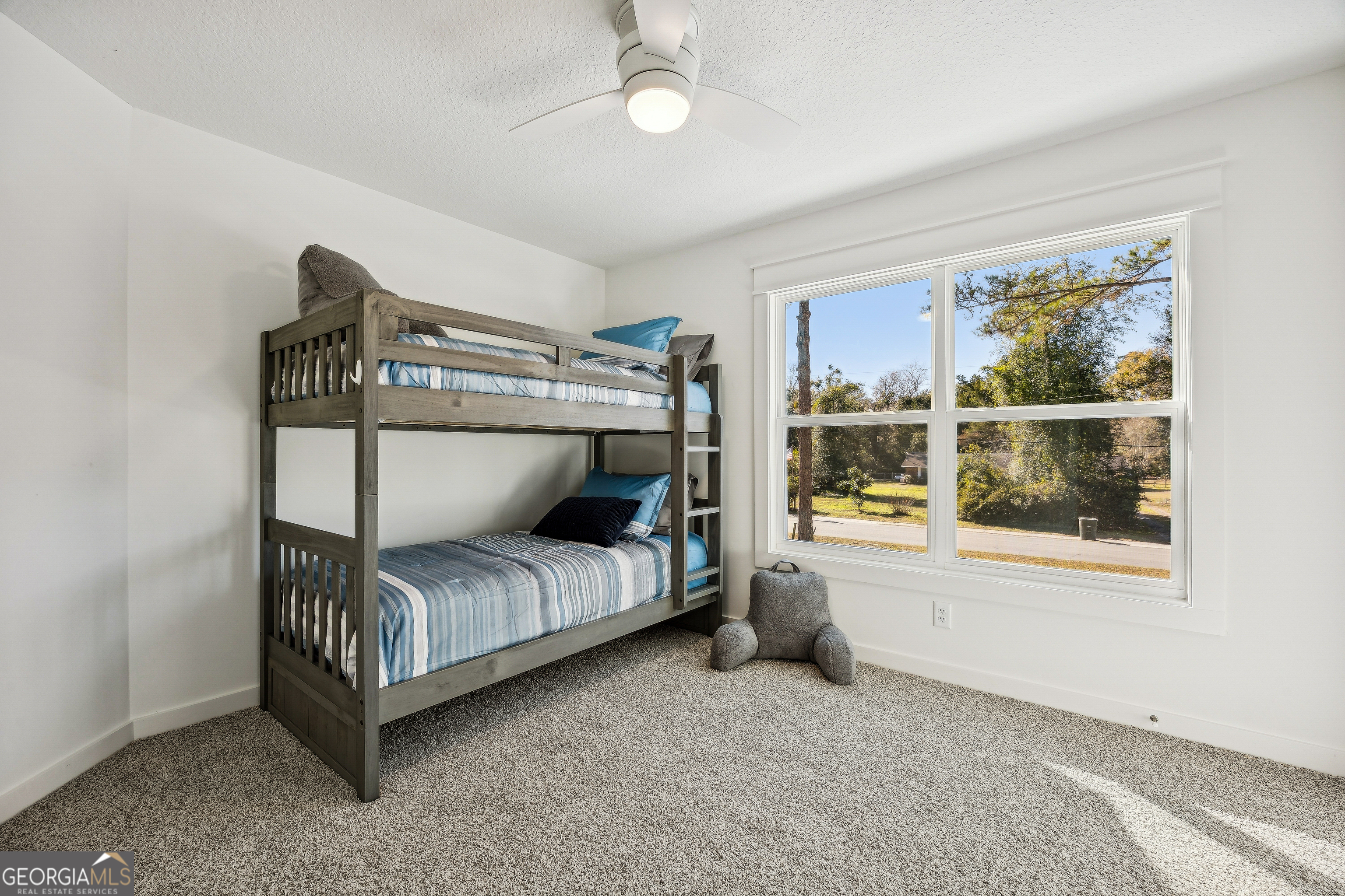182 Clarks Bluff Road Kingsland, GA 31548 - Photo 20 of 27 a bedroom with a bed and window
