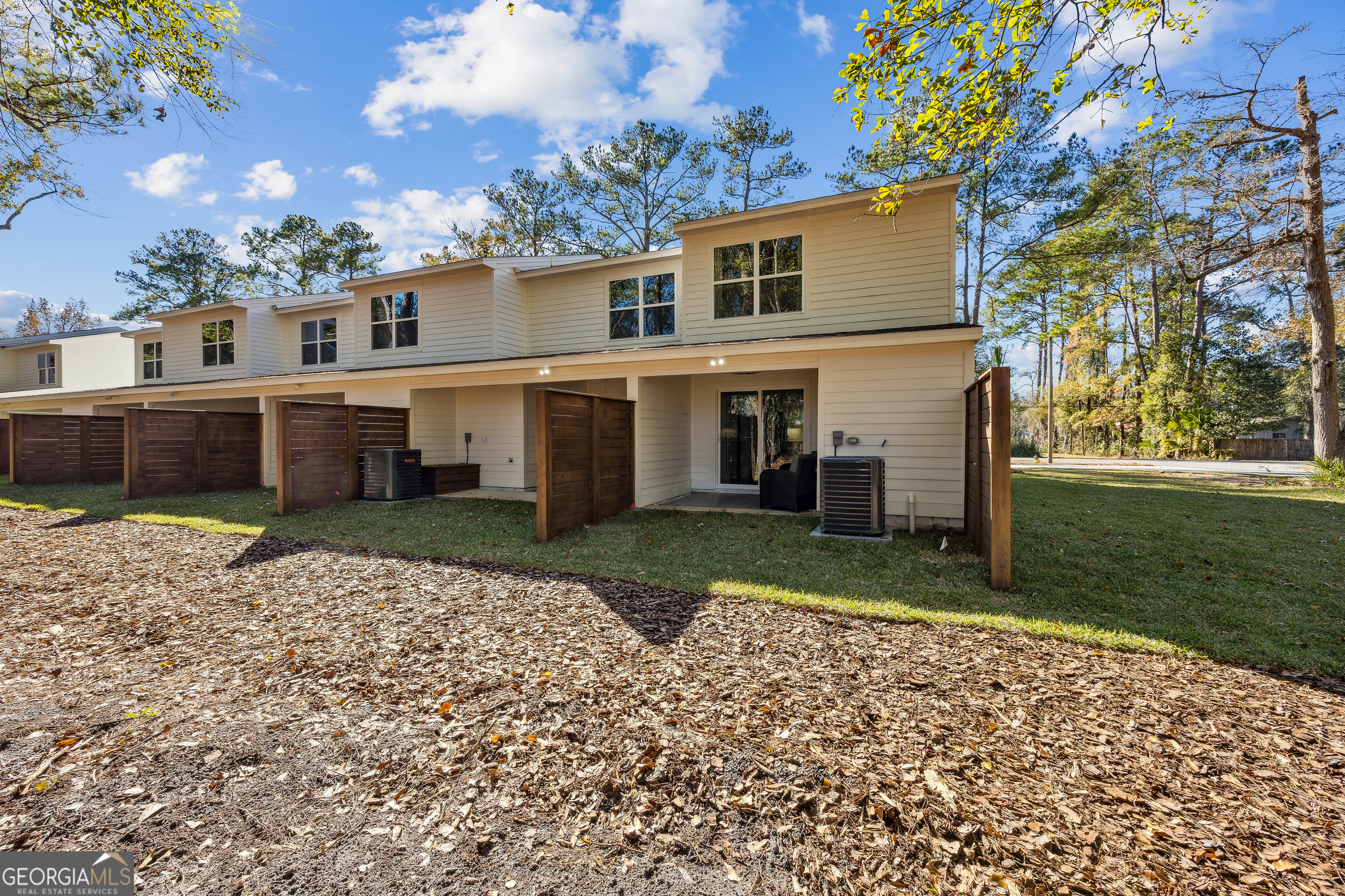 182 Clarks Bluff Road Kingsland, GA 31548 - Photo 26 of 27 a front view of a house with a yard and potted plants