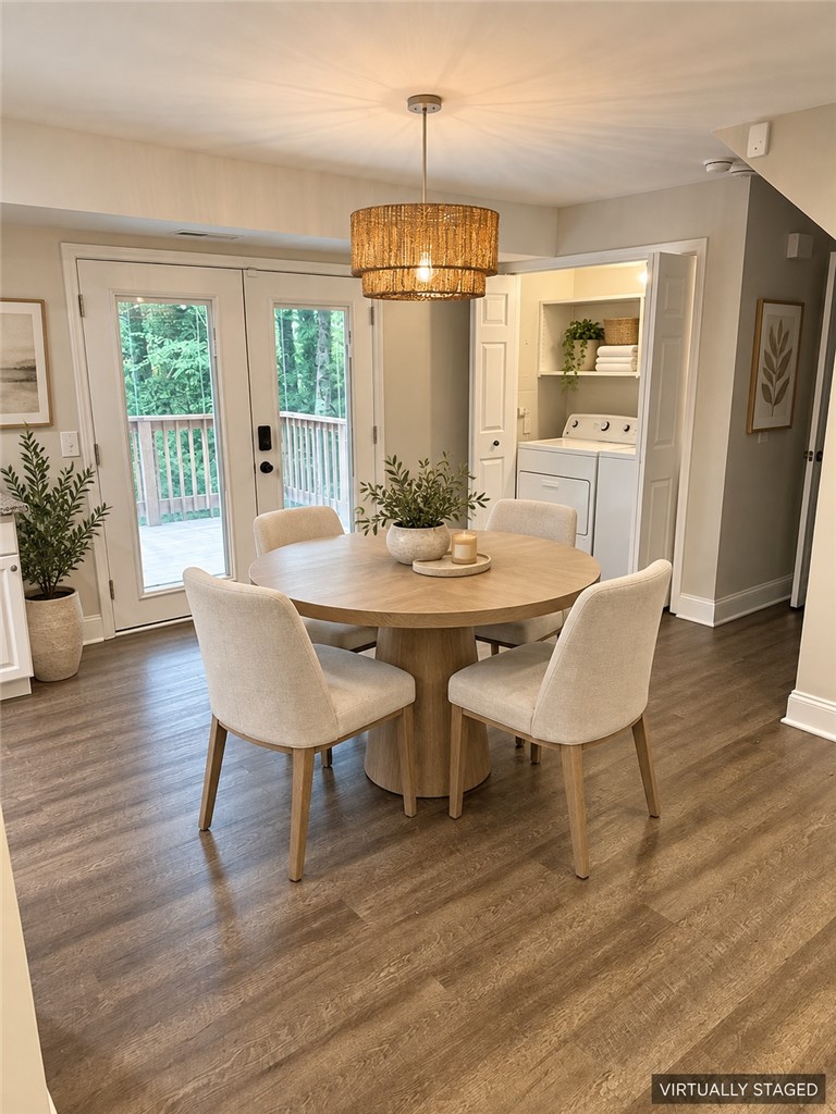 315 Rock Creek Road Clemson, SC 29631 - Photo 3 of 15 Double glass doors open to a wooden deck from this dining space with wood floors.
