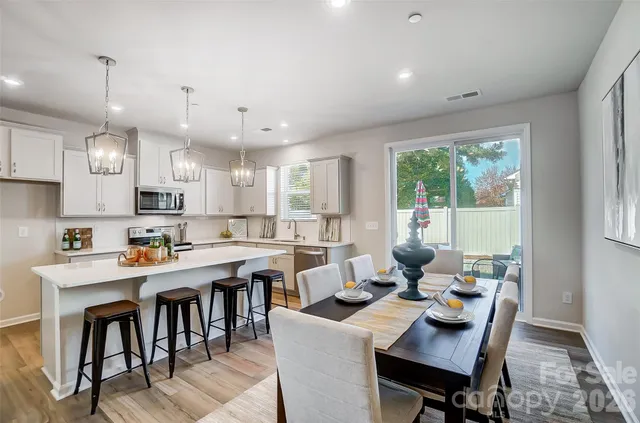 a view of a dining room and livingroom view kitchen