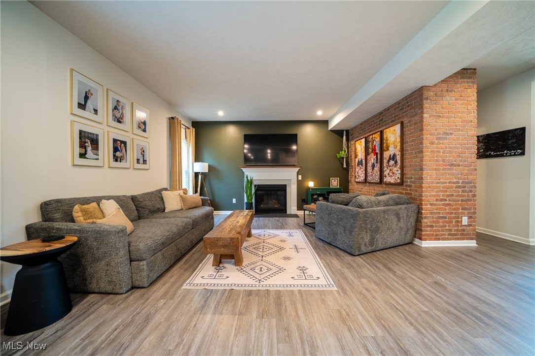 270 Stone Ridge Way Berea, OH 44017 - Photo 5 of 30 Living room with a fireplace and light hardwood / wood-style floors