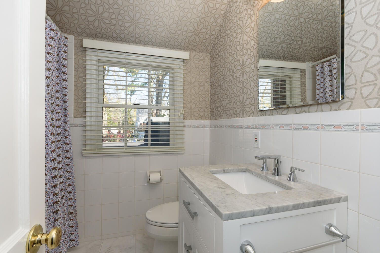 19 Laforge Road Darien, CT 06820 - Photo 21 of 33 a bathroom with a granite countertop toilet a sink and a window
