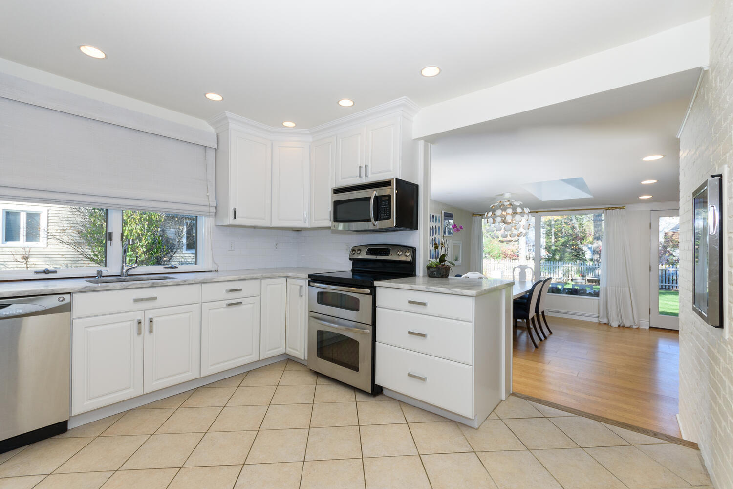 19 Laforge Road Darien, CT 06820 - Photo 8 of 33 a kitchen with cabinets and chairs