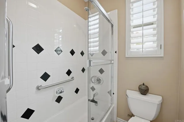 a bathroom with a bathtub and window