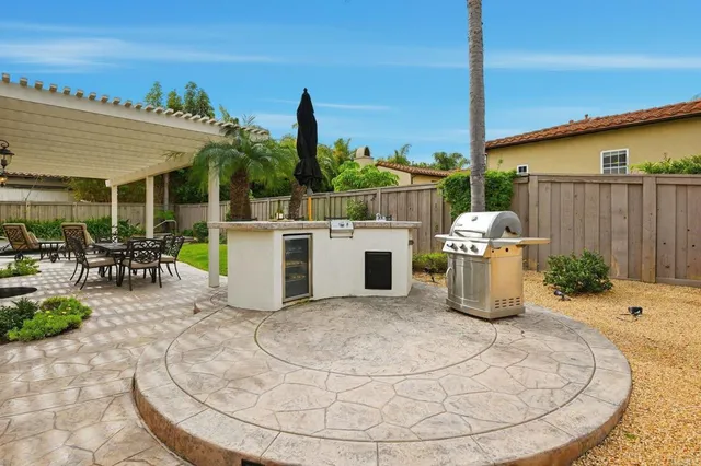 a view of yard with patio