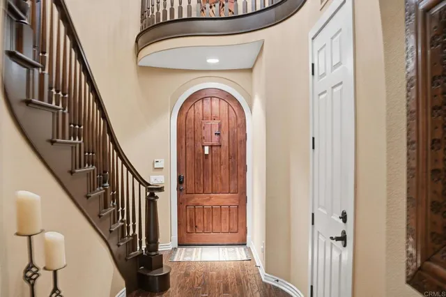 a view of an entryway with wooden floor