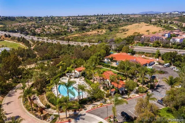 an aerial view of houses with yard