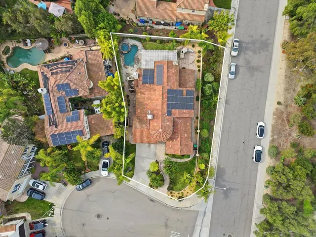 an aerial view of residential house with outdoor space and street view