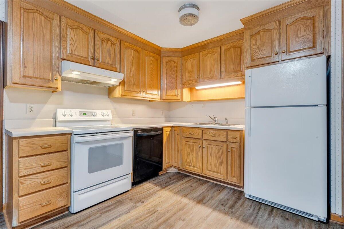 570 Scuffling Hill Road Rocky Mount, VA 24151 - Photo 11 of 35 a kitchen with granite countertop cabinets stainless steel appliances and wooden cabinets