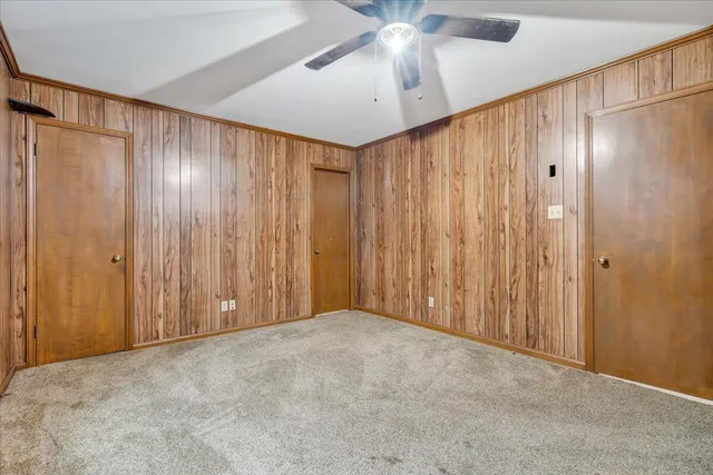 an empty room with closet area