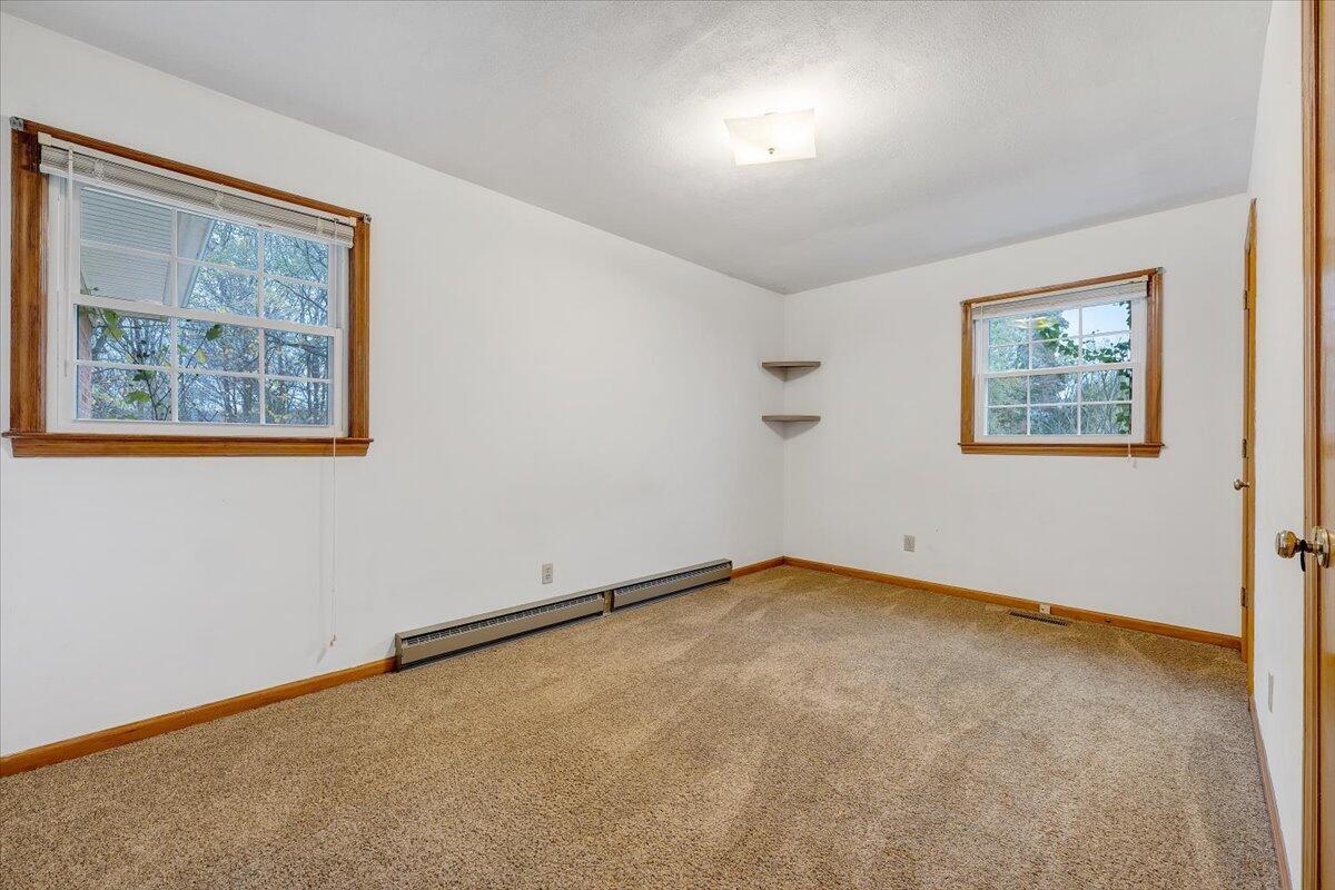 570 Scuffling Hill Road Rocky Mount, VA 24151 - Photo 19 of 35 a view of an empty room with a window