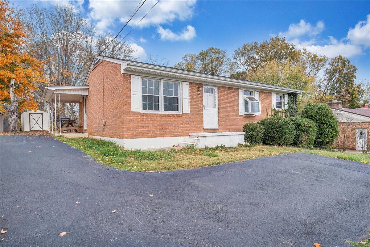 570 Scuffling Hill Road Rocky Mount, VA 24151 - Photo 2 of 35 a front view of a house with a yard and garage