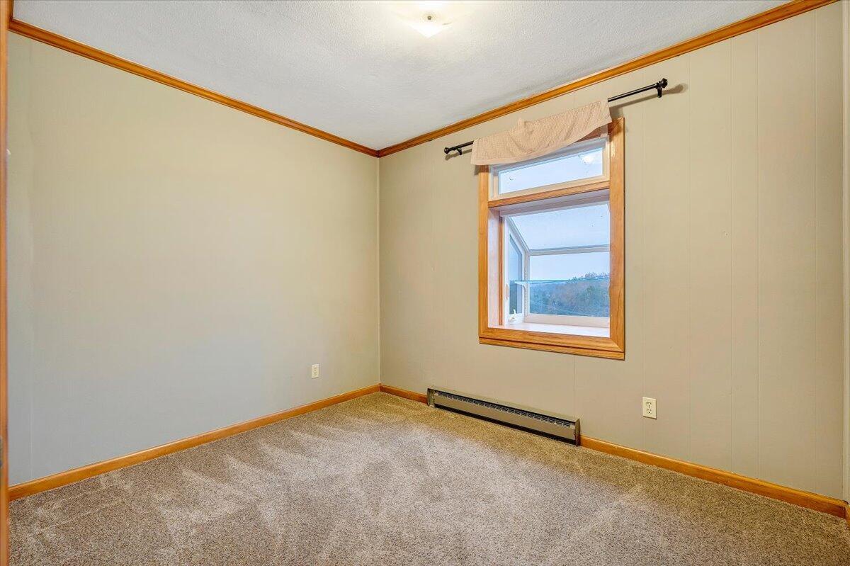 570 Scuffling Hill Road Rocky Mount, VA 24151 - Photo 22 of 35 a view of an empty room with a window