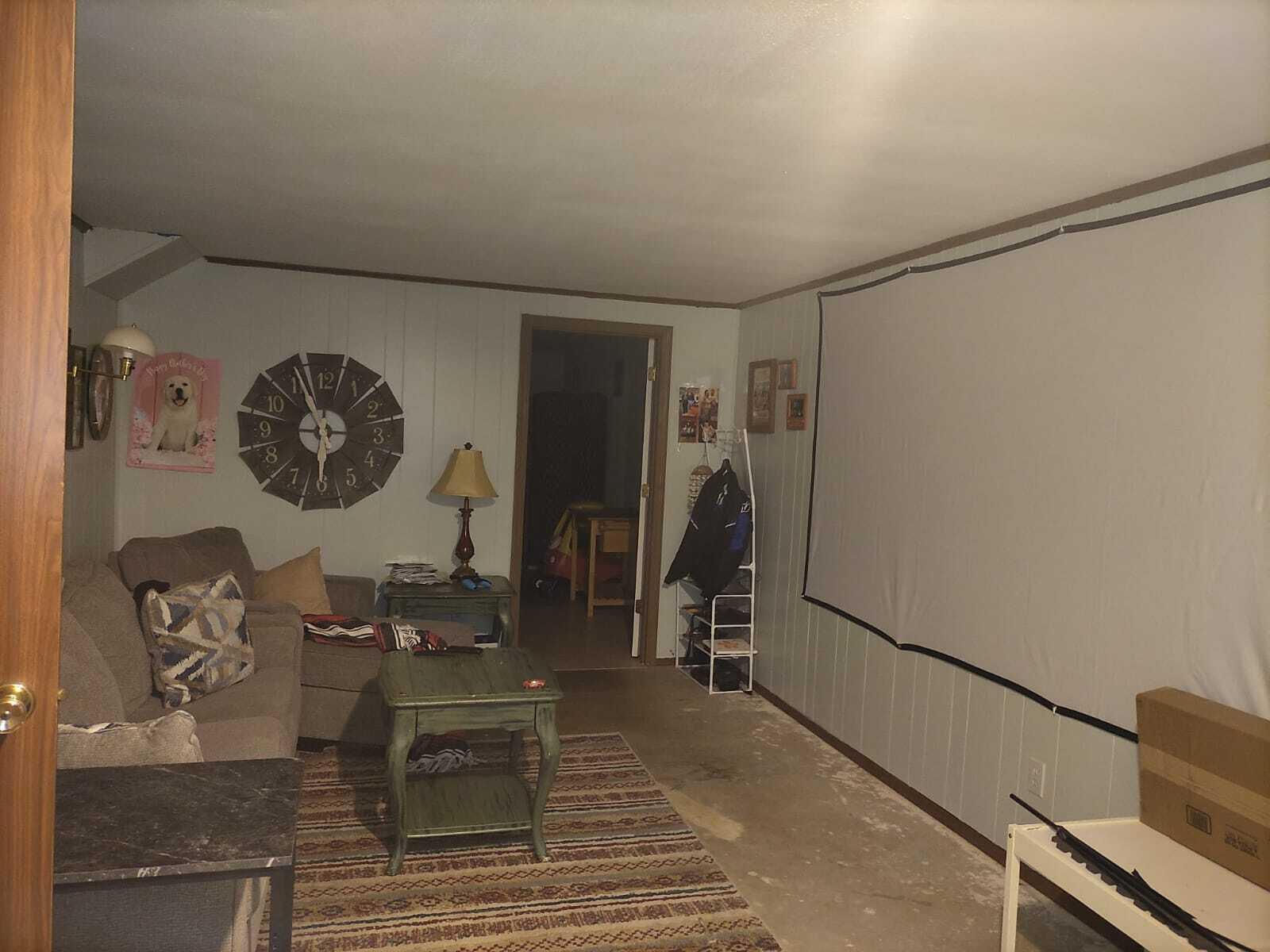 570 Scuffling Hill Road Rocky Mount, VA 24151 - Photo 24 of 35 a view of a hallway with paintings on the wall